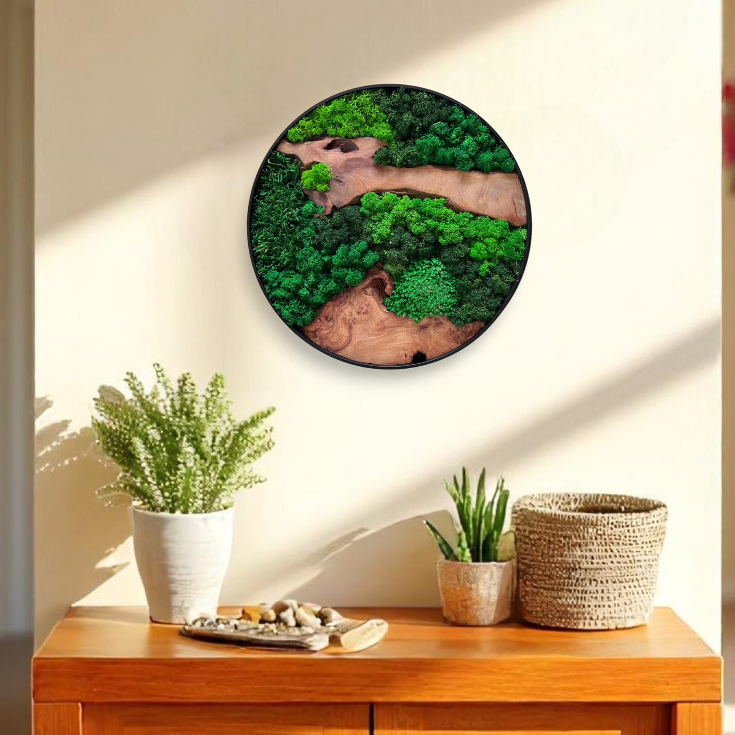 Serenzy Round Moss & Cedar Wall Art with Irregular Linear Wood hanging in a modern living room above a cabinet with plants