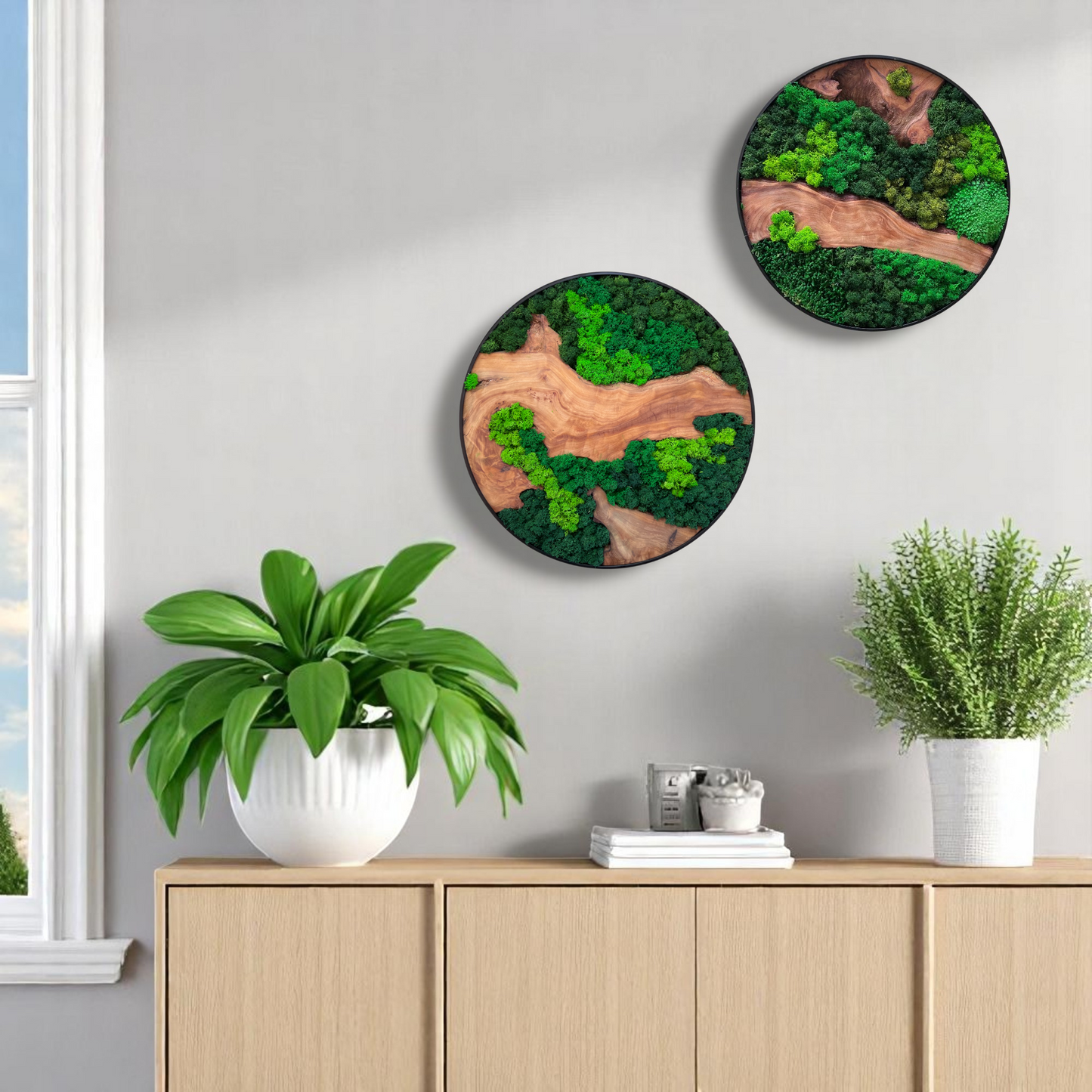 Two Serenzy Round Moss & Cedar Wall Art pieces arranged on a wall above a cabinet with lush plant decor