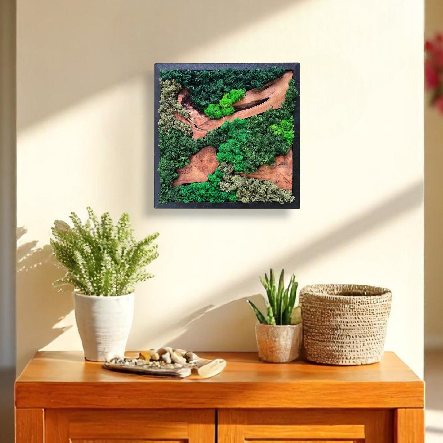 Serenzy Square Moss & Cedar Wall Art with Angled Wood Design hanging in a modern living room above a cabinet with plants